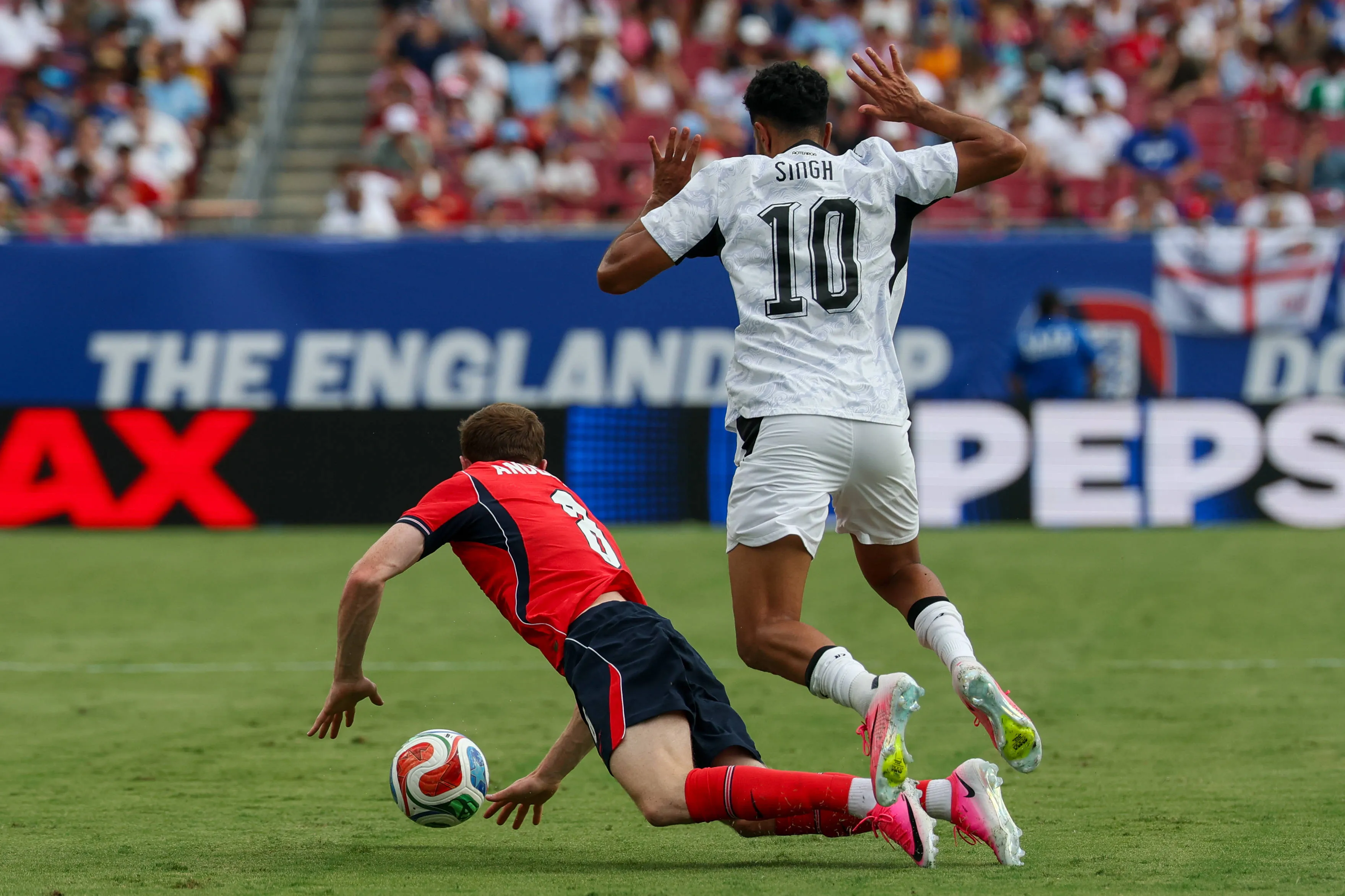 Elliot Anderson draws a foul from Sarpreet Singh during England's final World Cup warm-up friendly vs New Zealand