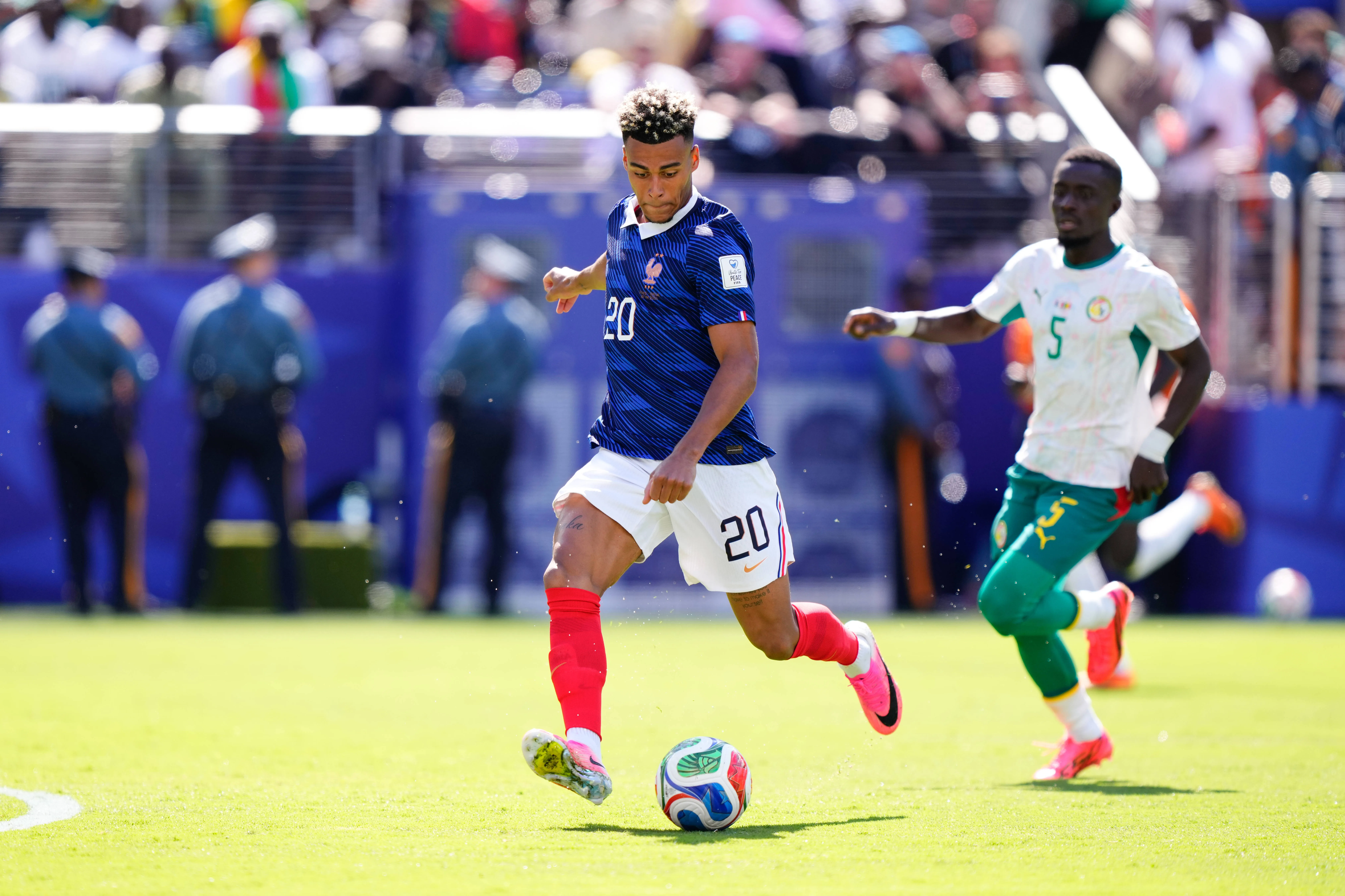 Desire Doue of France takes a shot against Senegal