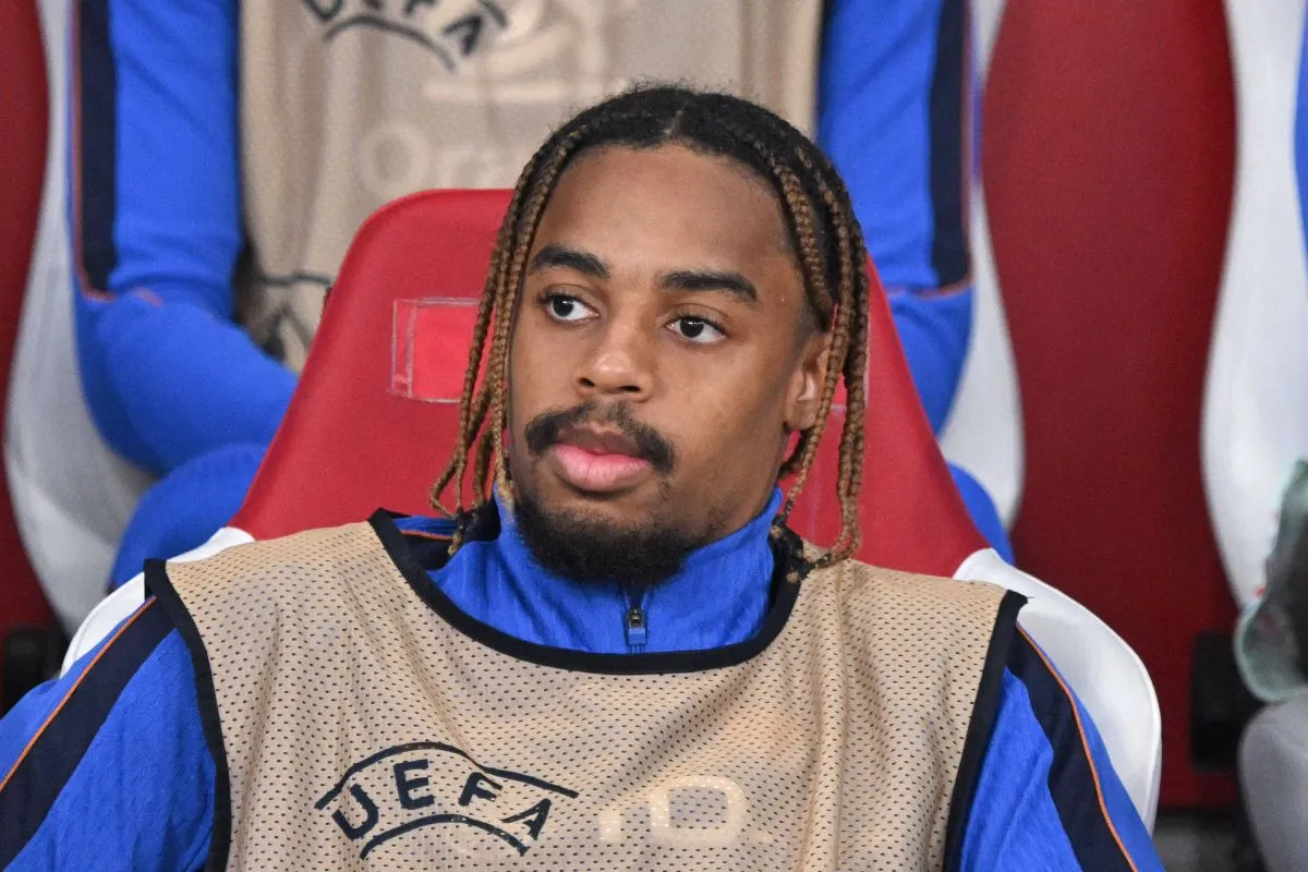 PSG star Bradley Barcola pictured on the bench.