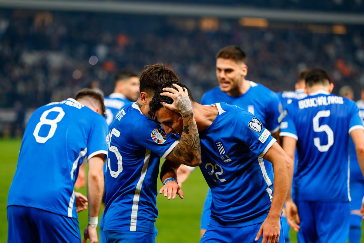 Greece players celebrate a goal 