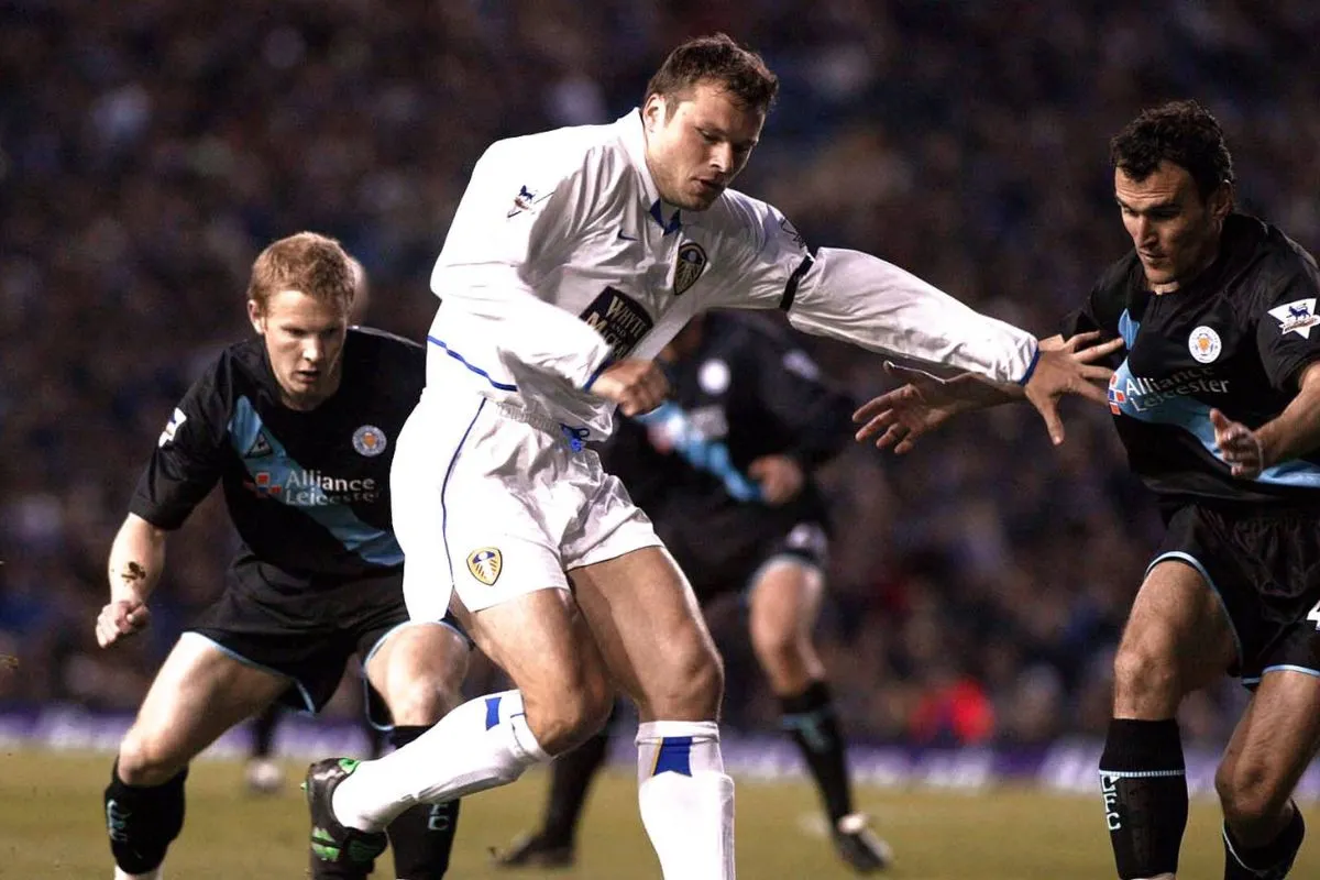 Mark Viduka battles for the ball during a Leeds United match.