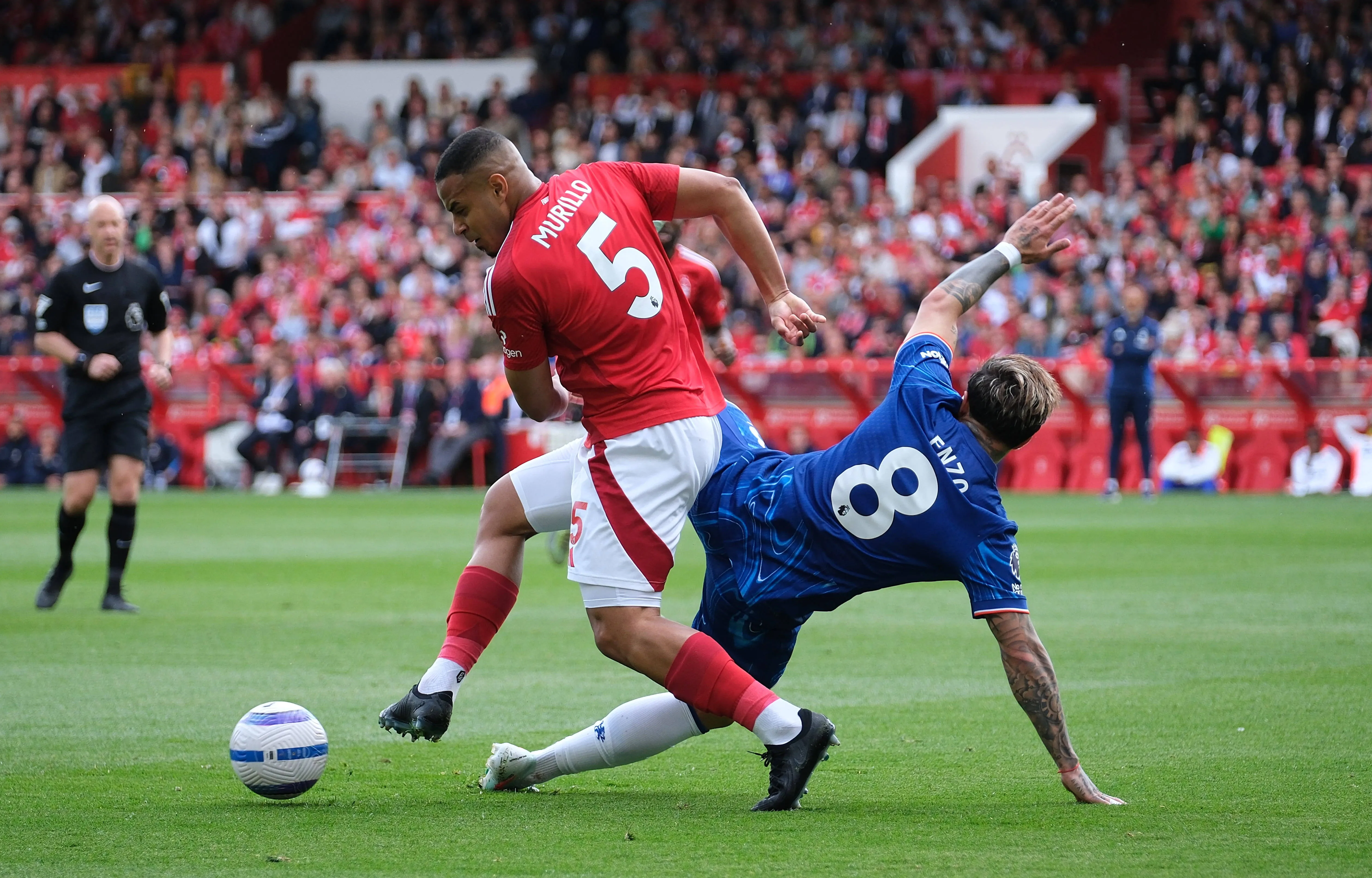 Murillo of Nottingham Forest and Enzo Fernandez of Chelsea in action