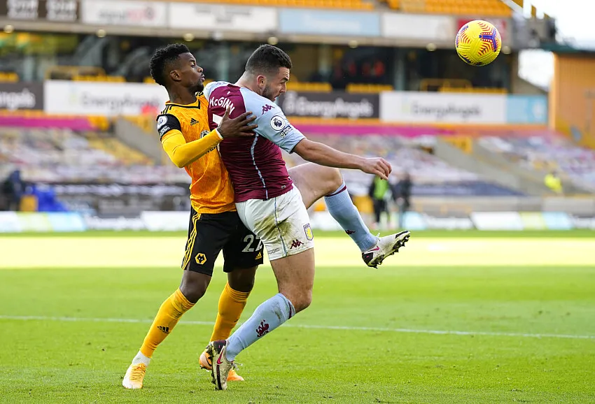 Nelson Semedo battles John McGinn at Molineux