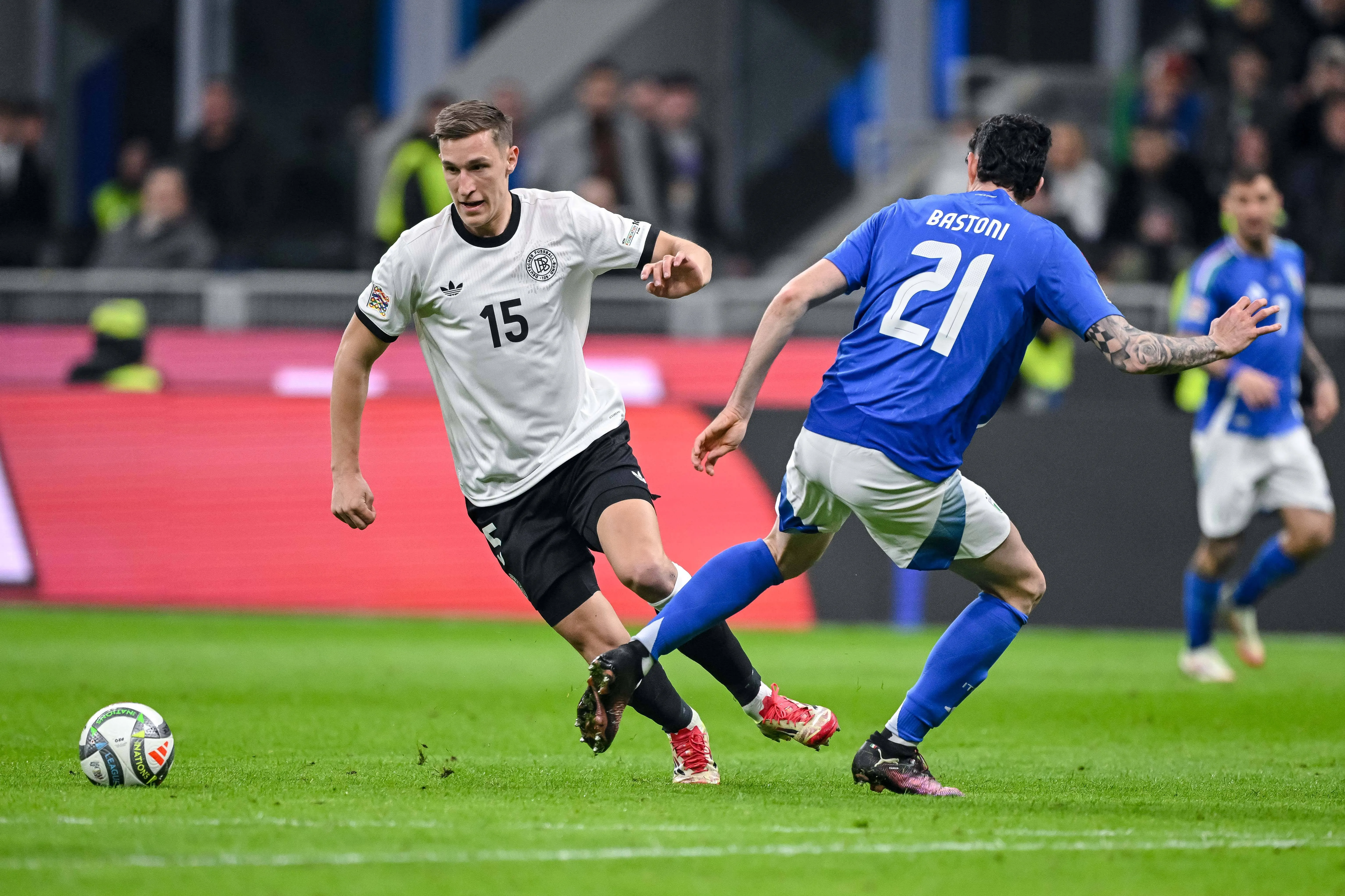 Nico Schlotterbeck of Germany and Alessandro Bastoni of Italy