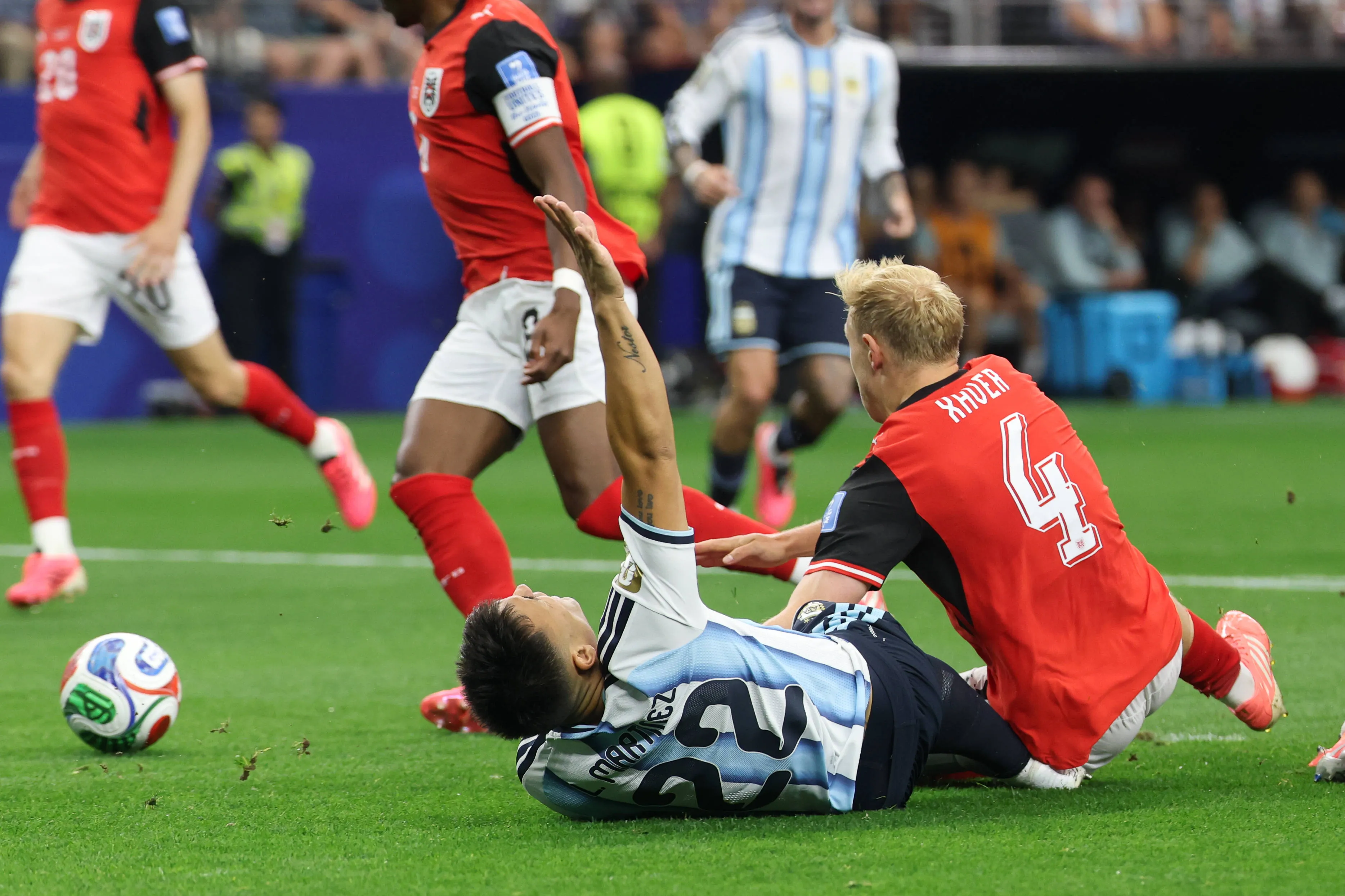 Austria's Xaver Schalger challenges Argentina forward Lautaro Martinez
